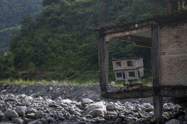 Abandoned houses are visible in Chanaute Market, northeast of Kathmandu, Nepal, Sunday, Sept. 15, 2024. (AP Photo/Niranjan Shrestha)