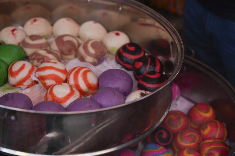 Sweet bao buns are displayed for sale in Chinatown, in Mexico City's historic center, Saturday, June 8, 2024. (AP Photo/Fernando Llano)