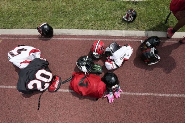 Equipment sits on the field as the Baker High football teams readies for practice in Baker, La., Wednesday, Aug. 28, 2024. (AP Photo/Gerald Herbert)