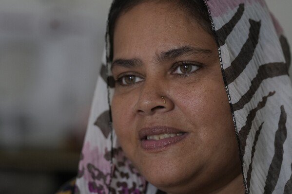 Fathima Shiyama, 48, who sells food on a mobile cart to support her five children, speaks to the Associated Press at her residence in Colombo, Sri Lanka, Tuesday, Sept. 3, 2024. (AP Photo/Eranga Jayawardena)