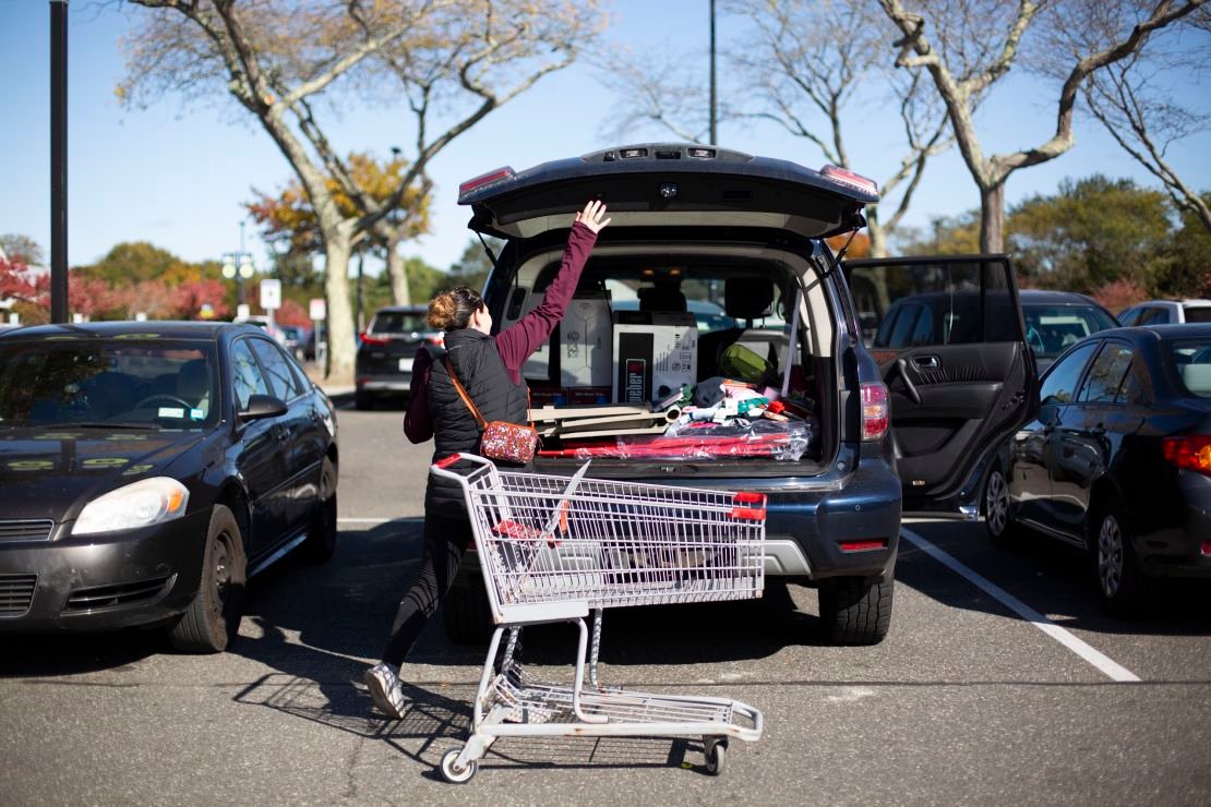 Jessica Cohan fills her car with her purchases at the Bridgehampton Kmart's going out of business sale.