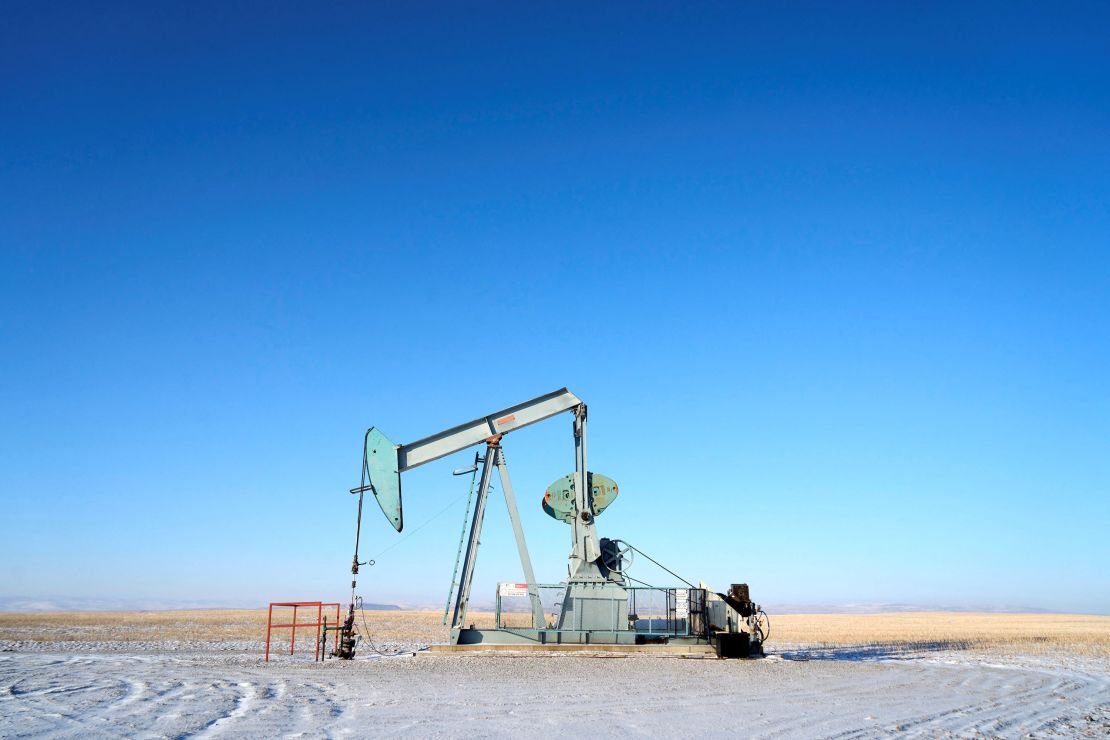 An oil pump jack works on the prairies near Claresholm, Alberta, Canada, on January 18.