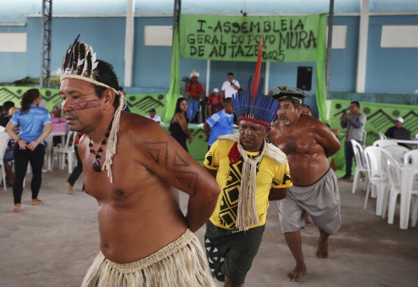 Mura Indigenous people perform traditional dance during the opening of a gathering in Autazes, Amazonas state, Brazil, Wednesday, Feb. 19, 2025. (AP Photo/Edmar Barros)